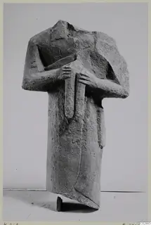 Headless limestone statue of a standing figure with arms crossed over the chest, from Kition
