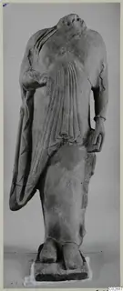 Headless limestone statue of a draped standing figure from Kition