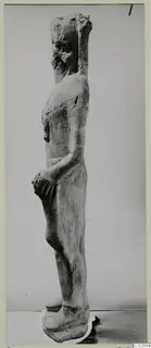 Limestone standing figure seen in side view, a find from Kition
