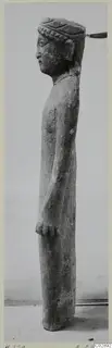 Limestone standing figure, shown in profile, with a banded headdress, from Kition