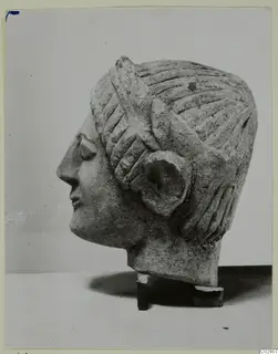 Limestone sculpture of a head in profile facing left, from Kition