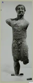 Limestone Cypro-Greek II statue of a standing nude male figure, from Kition