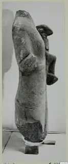 Limestone statue fragment K. 465 from Kition, seen from the side, with a bent arm and a projecting head or shoulder