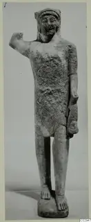 Limestone statuette of a standing figure with one arm raised, Kition