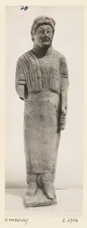 Limestone statue of a standing bearded figure in a long robe with a draped shawl, from Kition