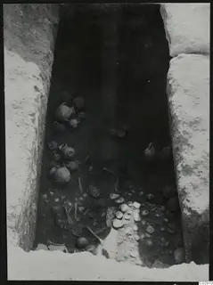 Tomb 10 at Amathus seen from above, with pottery vessels and bones lying in situ on the floor