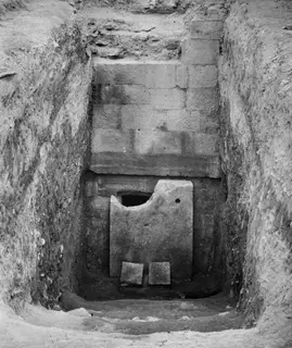 Dromos of Tomb 2 at Amathus before opening, with a stone slab closing the entrance at the foot of the cutting