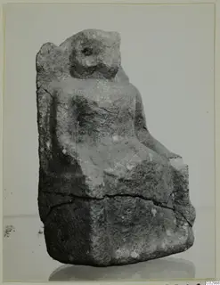 Limestone sculpture of a seated figure on a high-backed chair, from Vouni