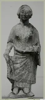 Limestone statuette of a standing figure holding a dish, from Vouni