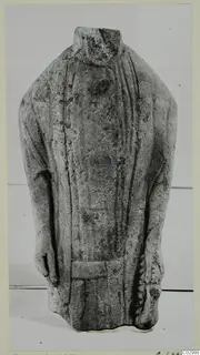 Headless limestone statuette of a standing figure in a long garment, from Kition