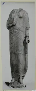 Limestone statue of a standing draped female figure from Vouni, head missing