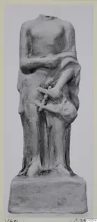 Headless terracotta standing figure with a draped garment on a rectangular base, from Vouni