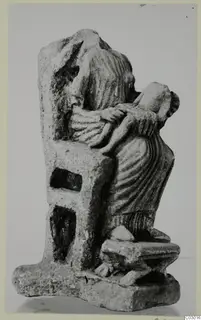 Limestone sculpture group of a draped female figure holding a small child, from Vouni; the larger figure's head is broken off