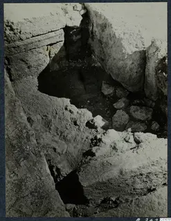 Excavation pit among large stone blocks at the palace at Vouni.