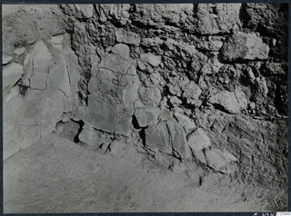 Excavated stone wall with a floor of packed earth at the palace at Vouni