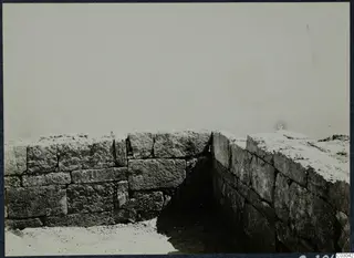 Corner of two excavated stone walls built of large rectangular blocks at the palace at Vouni
