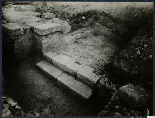 Stone steps and stone walls exposed in an excavation trench at Vouni