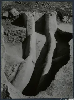 Excavation trench with pale walls and scattered stones at the palace at Vouni