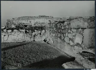 Ancient stone walls and a paved surface at the palace at Vouni