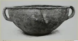 Pottery Plain White Hand-made Ware bowl with two loop handles, photographed alone