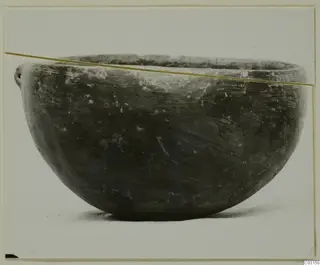 Red Polished III bowl from the Vrysi tou Barba tombs at Lapithos, side view.