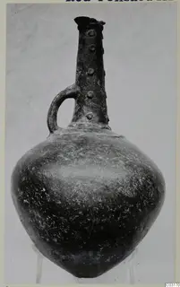 Red Polished III jug from Lapithos with a loop handle and small knobs on the neck