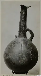 Red Polished III jug from Lapithos, Vrysi tou Barba tombs, with a tall neck and single loop handle