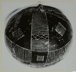 Black Polished pottery vessel from Lapithos with white linear patterns on a round body