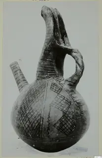 Pottery jug from Lapithos, White Painted I-II, with a tall neck, side spout and dark painted cross-hatched panels