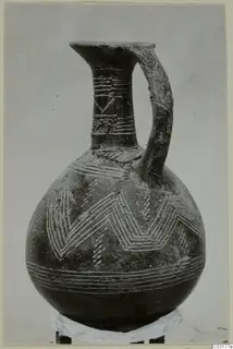 Jug with one handle, a tall neck and pale zigzag and horizontal bands, from Lapithos