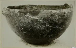 Pottery Red Polished I bowl from Lapithos, with two small lugs on the rim, seen from the side.