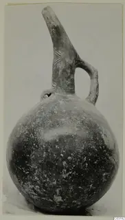 Red Polished III jug from Lapithos, Vrysi tou Barba tombs, with a long tapering neck and strap handle