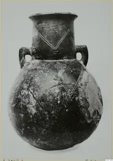 Amphora from Lapithos with two loop handles and incised V-shaped lines with dots on neck and shoulder