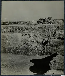 Large cut stone blocks and a stepped structure at the palace at Vouni, with rubble behind.