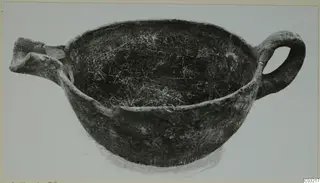 Pottery Red Polished III bowl with a loop handle on the right and a broken spout or lug on the left