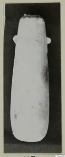 Alabaster vase with two small lug handles near the rim, photographed against a dark background