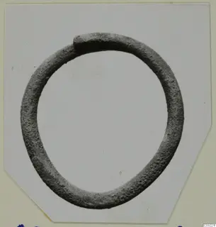 Closed metal ring of round section, one end overlapping the other, from Ayios Iakovos