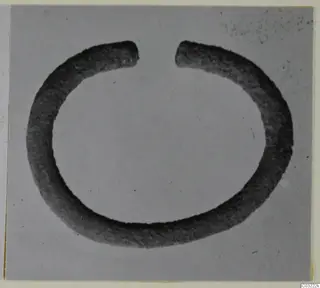 Open silver ring, a thick penannular band with its two ends apart at the top