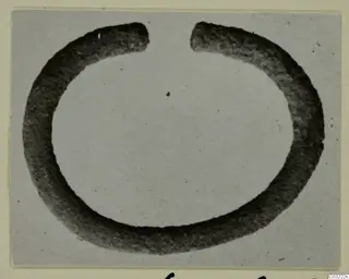 Open ring-shaped object from Marion Tomb 60, shown large against a pale grey background
