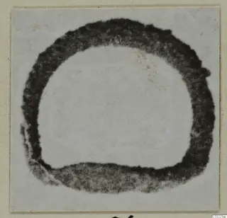 Ring from Marion: a thick, dark ring shape, soft and blurred, on a pale background.