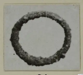 Ring from Marion, a thick dark circular band photographed flat against a pale background