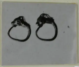 Two gold rings from Marion shown side by side on a grey background
