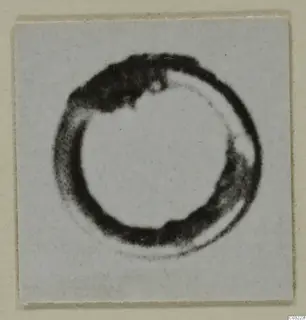 Blurred photograph of a single ring-shaped find from Marion, tombs 31-60, on a plain light background