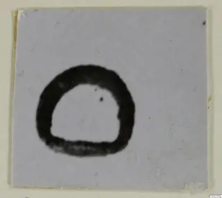 Ring-shaped jewellery object, recorded as silver, shown dark against a pale card