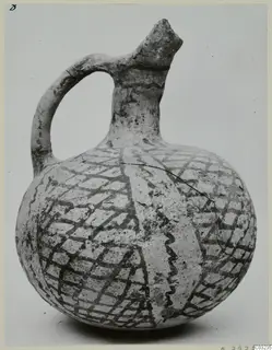 Pottery jug, White Painted III-2, from Lapithos, its round body covered with a dark lattice pattern