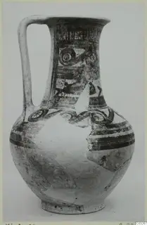 Pottery Bichrome Wheel-made jug from Milia with a loop handle and dark painted bands and circles