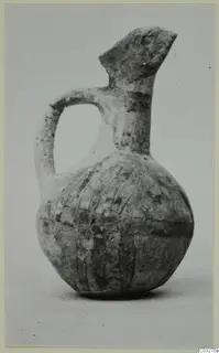 White Painted juglet from Milia with a single handle, flared spout and painted bands on the body