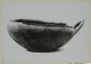 Pottery Monochrome Ware bowl with a single handle, from Milia