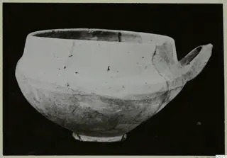 Base-Ring Ware pottery bowl with a single horizontal handle on its right side, from Milia