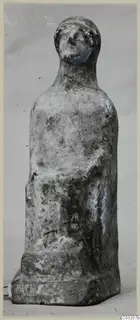 Terracotta figurine with folded arms on a low rectangular base, from Marion tombs 46–60 finds